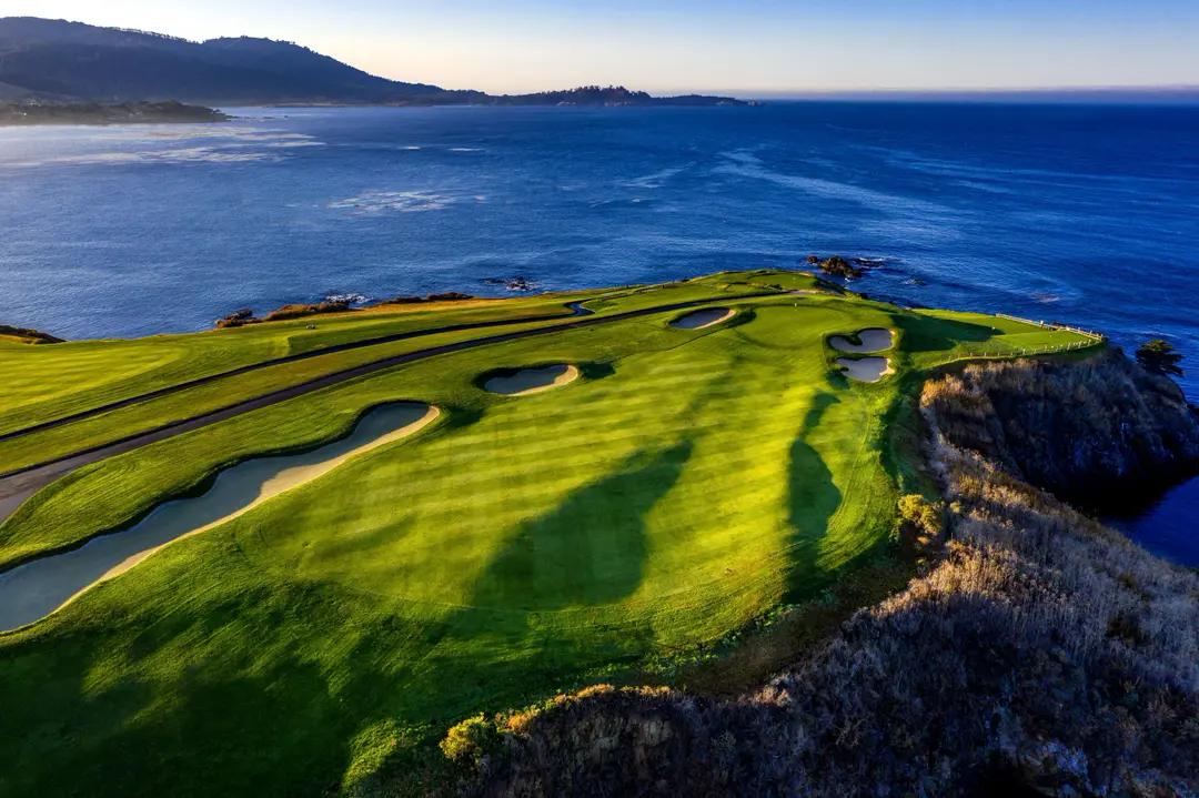 Pebble Beach inspired coastline artwork with ocean blues and fairway stripes.